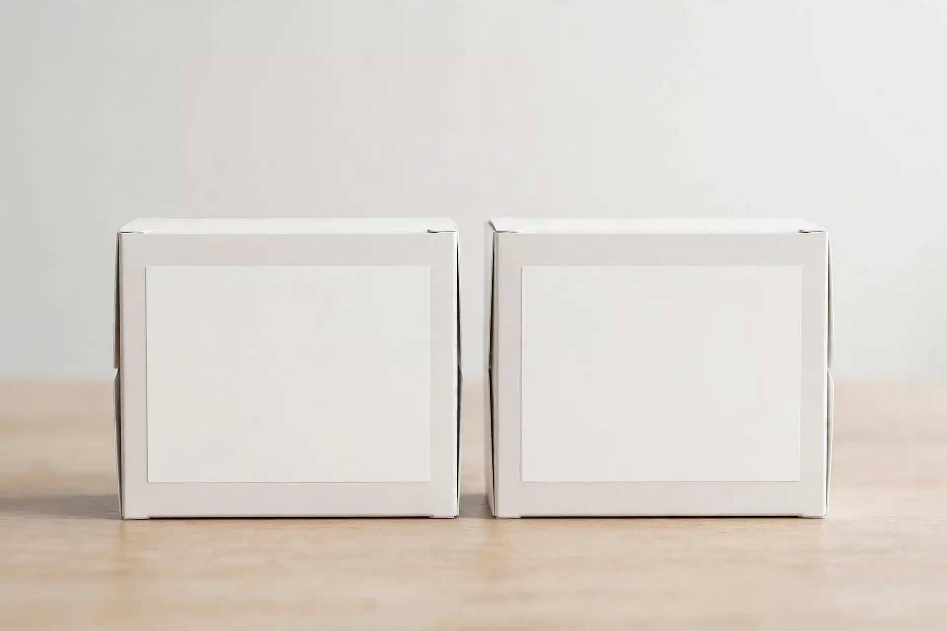 Two unmarked medicine boxes standing side by side