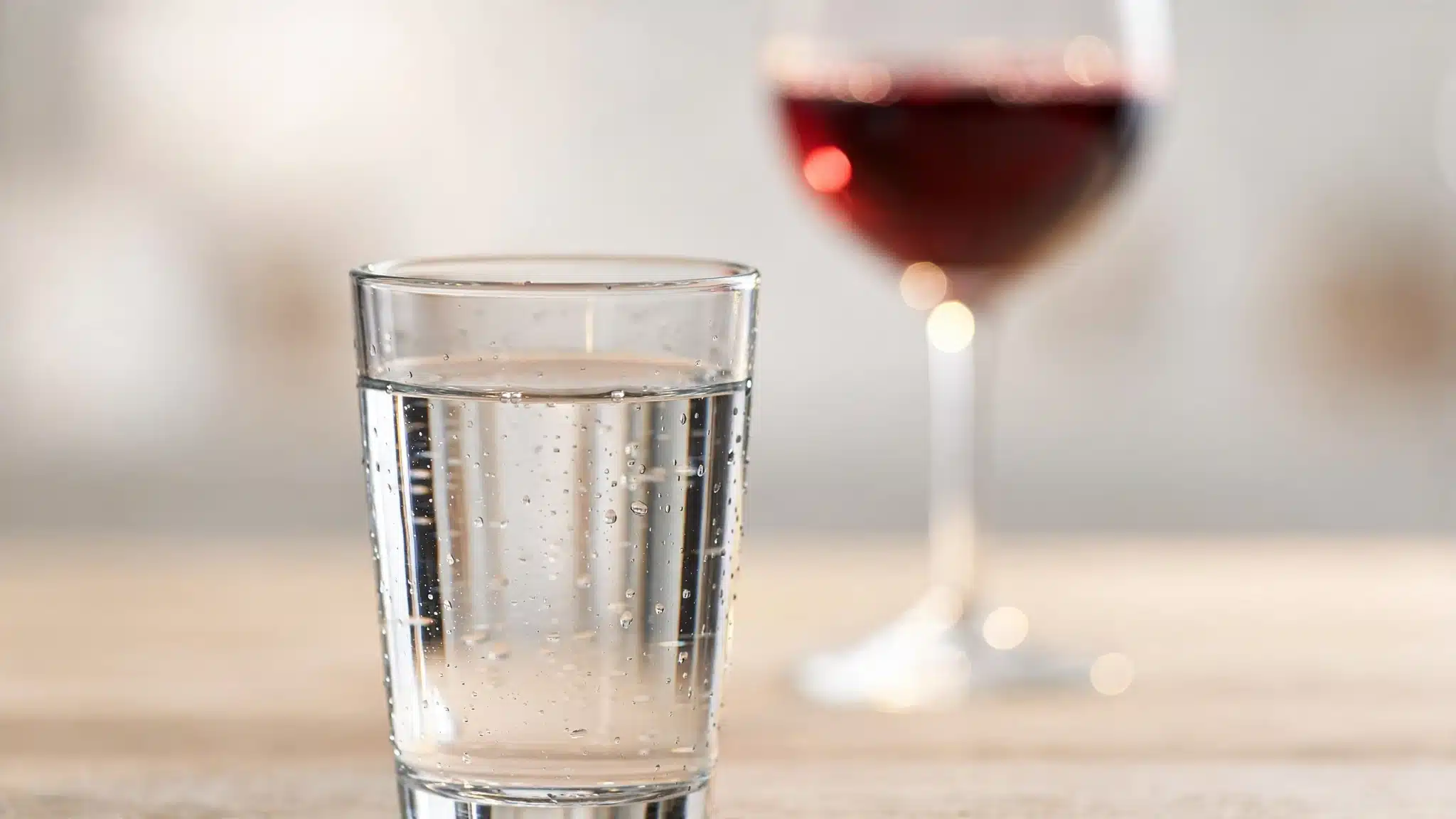 Plain glass of water on a neutral background